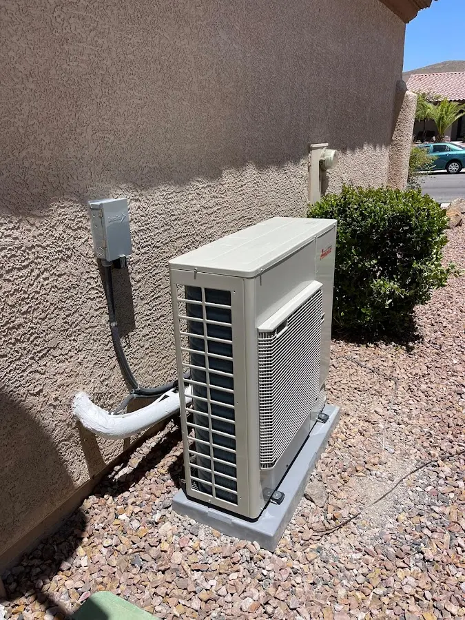 Residential air conditioning condenser unit in Lacombe